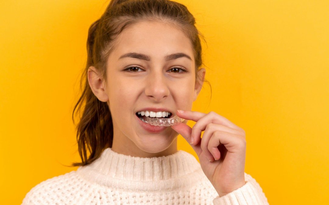 smiling woman in white knit sweater